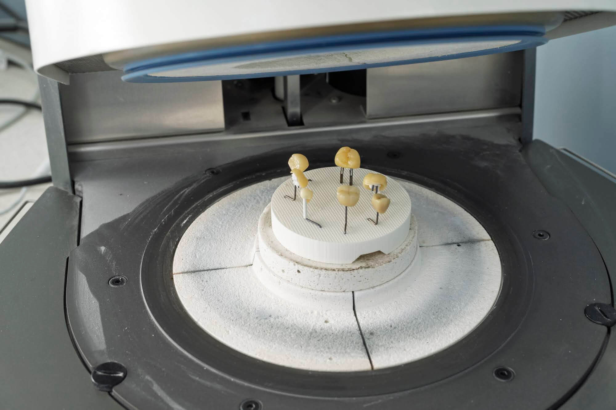 Ceramic restorations on firing pins during the sintering process