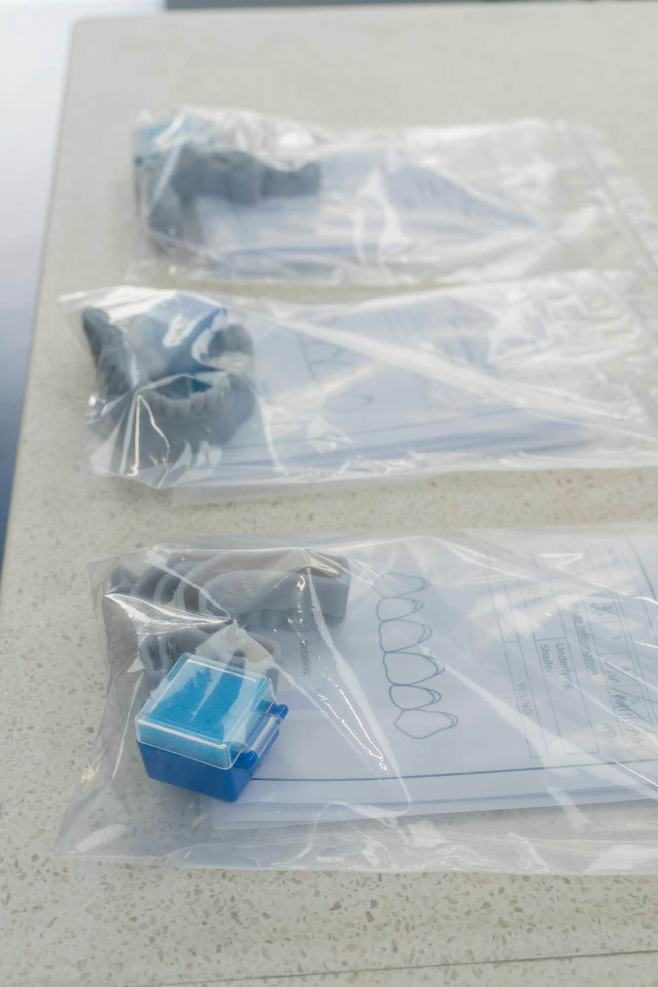 Finished dental cases in labelled bags ready for dispatch